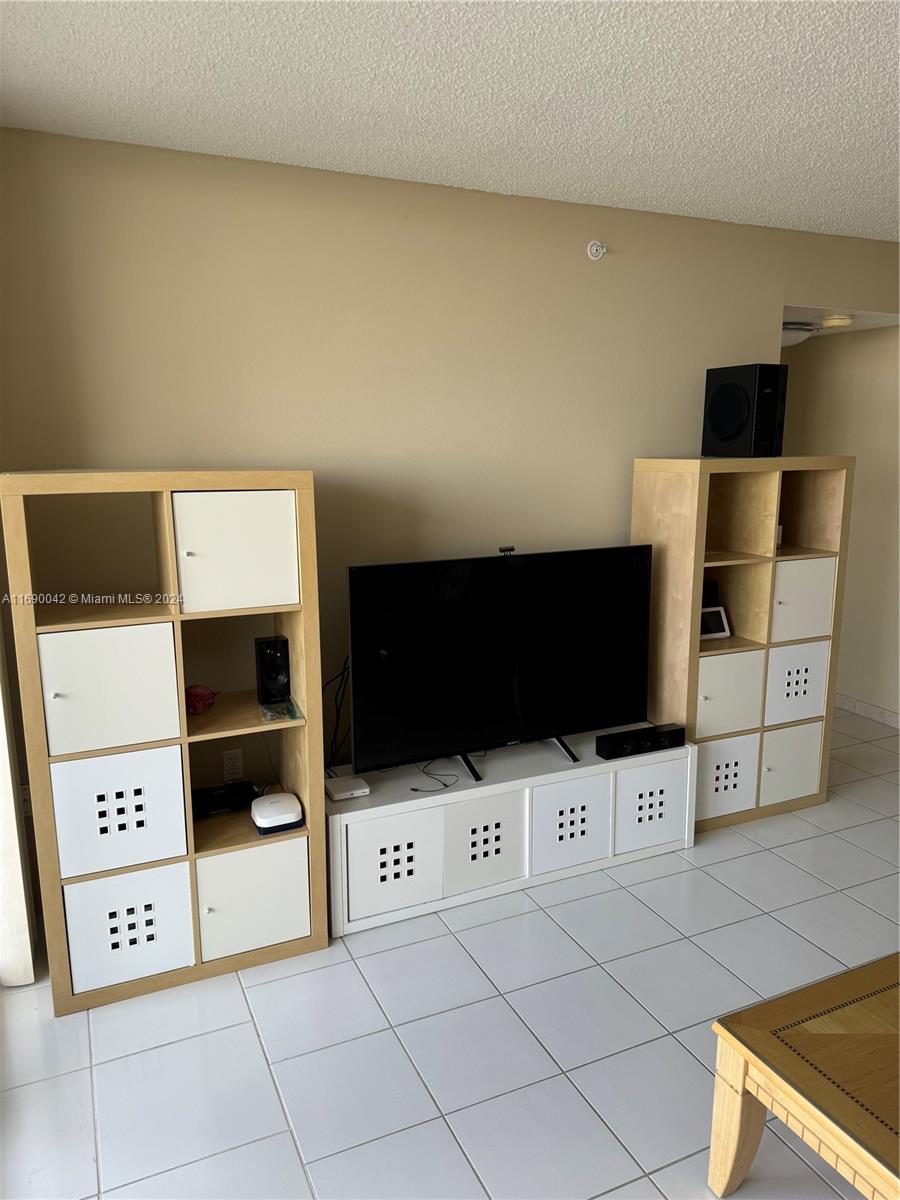 Sunset Harbour Miami Beach, FL 33139 - Photo 18 of 47 a living room with a flat screen tv and white door