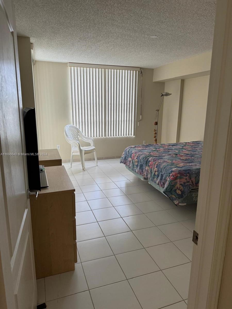 Sunset Harbour Miami Beach, FL 33139 - Photo 22 of 47 a bedroom with a bed and a mirror