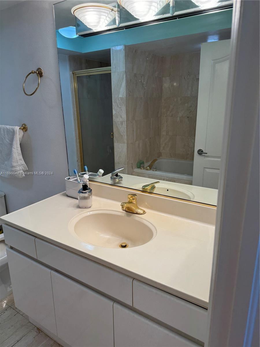 Sunset Harbour Miami Beach, FL 33139 - Photo 33 of 47 a bathroom with a sink and a mirror