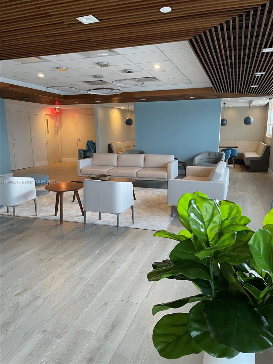 Sunset Harbour Miami Beach, FL 33139 - Photo 38 of 47 a living room with furniture and a potted plant