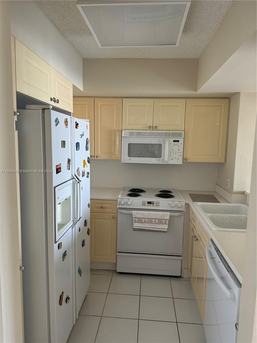 Sunset Harbour Miami Beach, FL 33139 - Photo 9 of 47 a kitchen with a refrigerator stove and sink