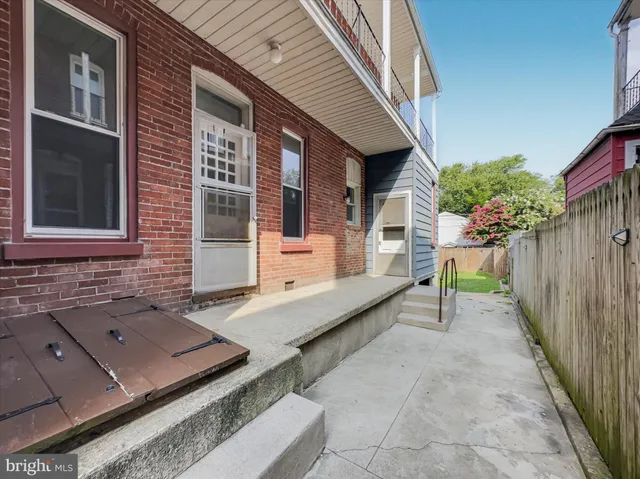 a view of house with backyard