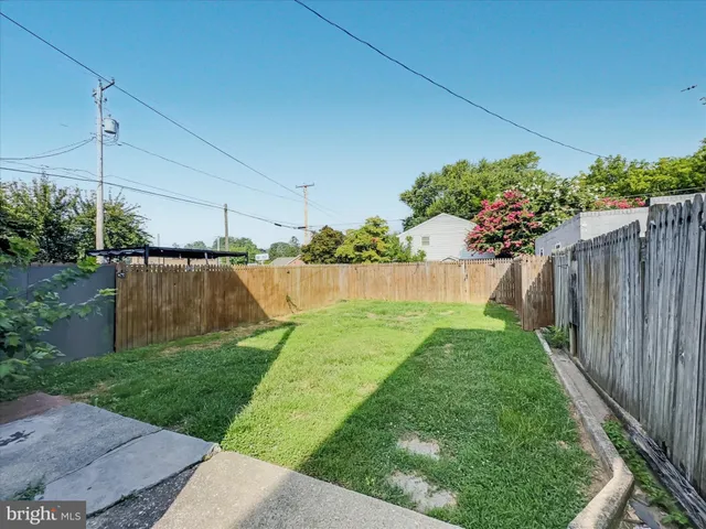 a view of a backyard with potted plants