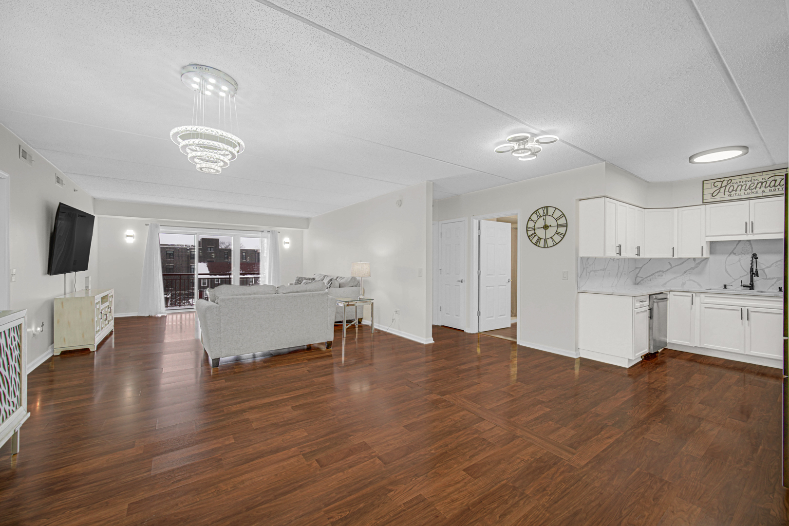 476 Alles Street, Unit 406 Des Plaines, IL 60016 - Photo 11 of 25 a view of empty room with wooden floor and fireplace