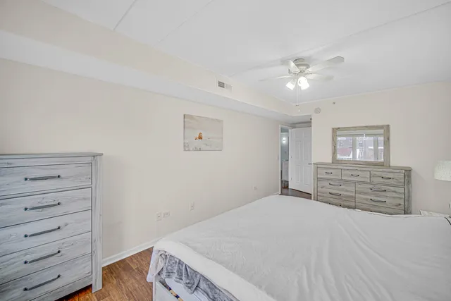 a bedroom with a bed and a dresser