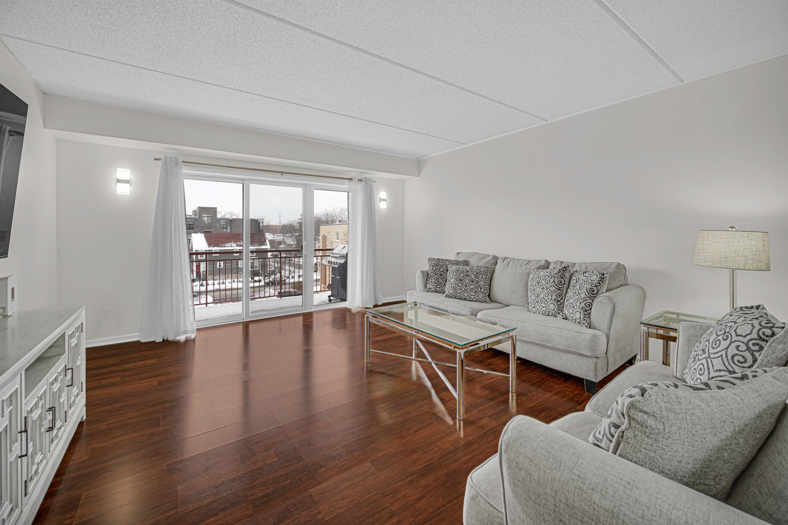 476 Alles Street, Unit 406 Des Plaines, IL 60016 - Photo 17 of 25 a living room with furniture and wooden floor