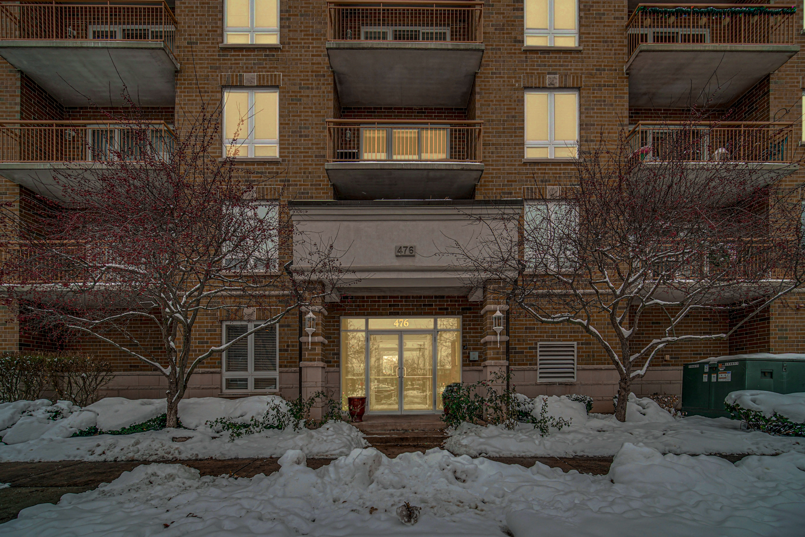 476 Alles Street, Unit 406 Des Plaines, IL 60016 - Photo 2 of 25 a front view of a house with a yard