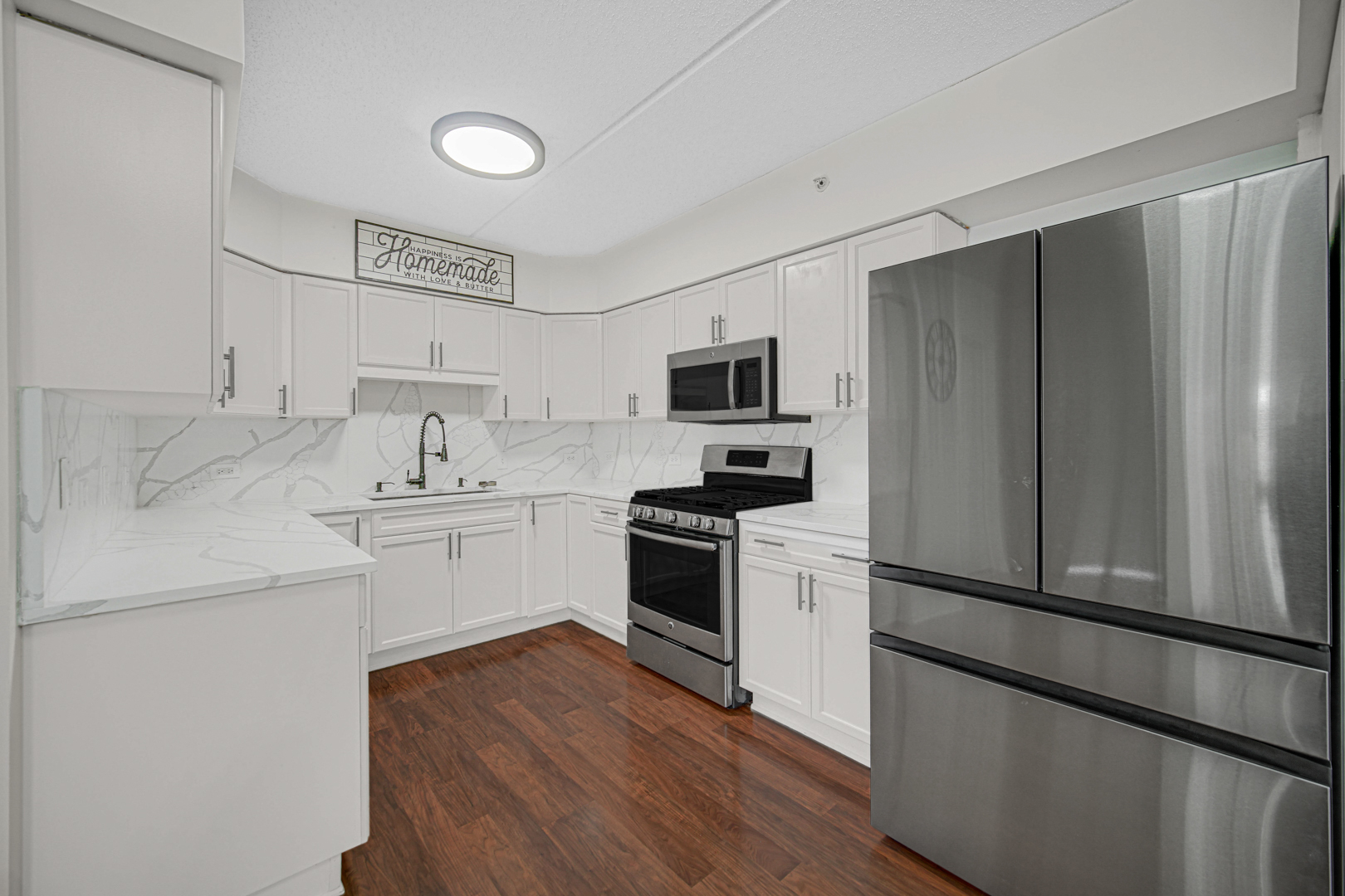 476 Alles Street, Unit 406 Des Plaines, IL 60016 - Photo 21 of 25 a kitchen with a refrigerator stove and sink