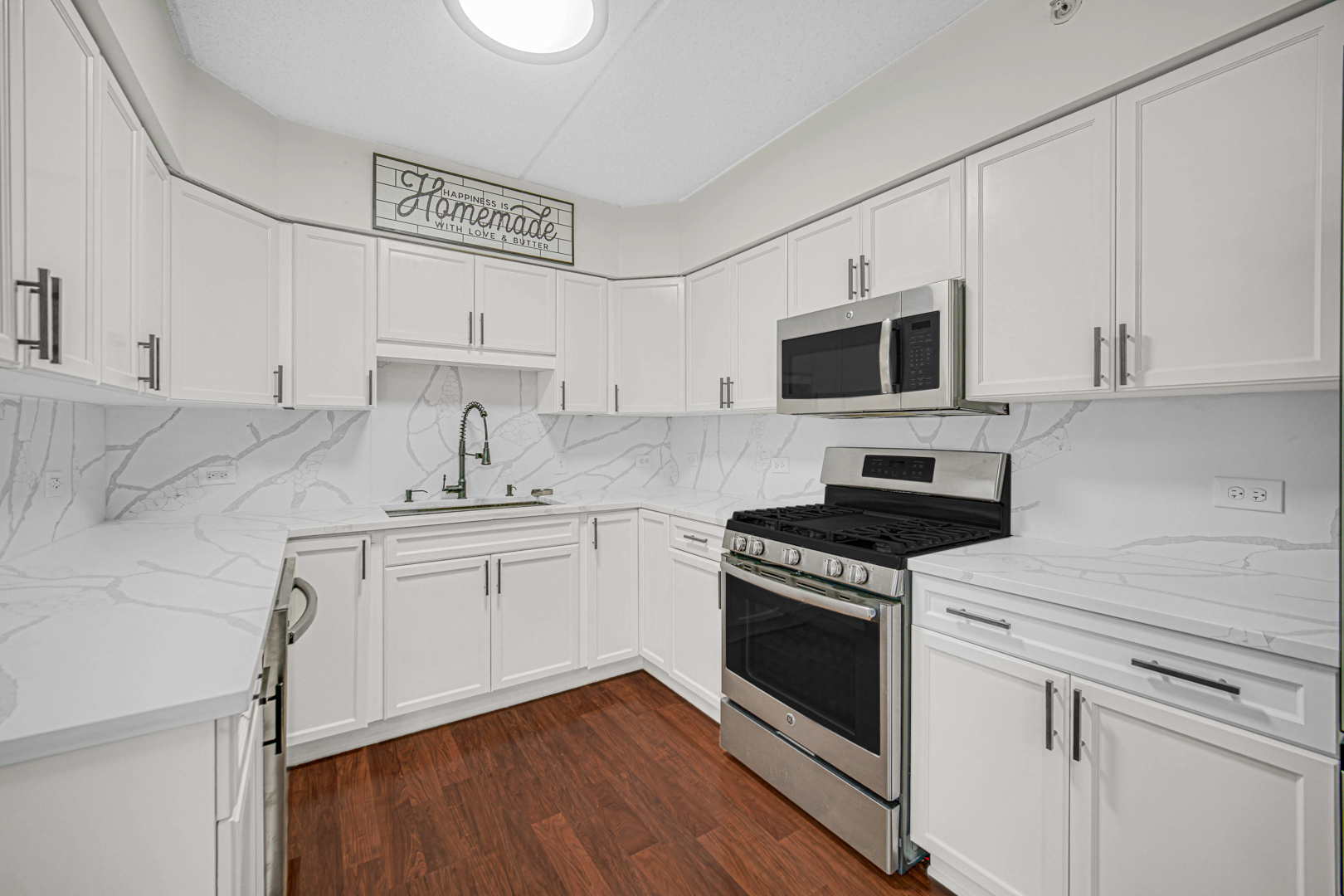 476 Alles Street, Unit 406 Des Plaines, IL 60016 - Photo 22 of 25 a kitchen with cabinets stainless steel appliances and wooden floor