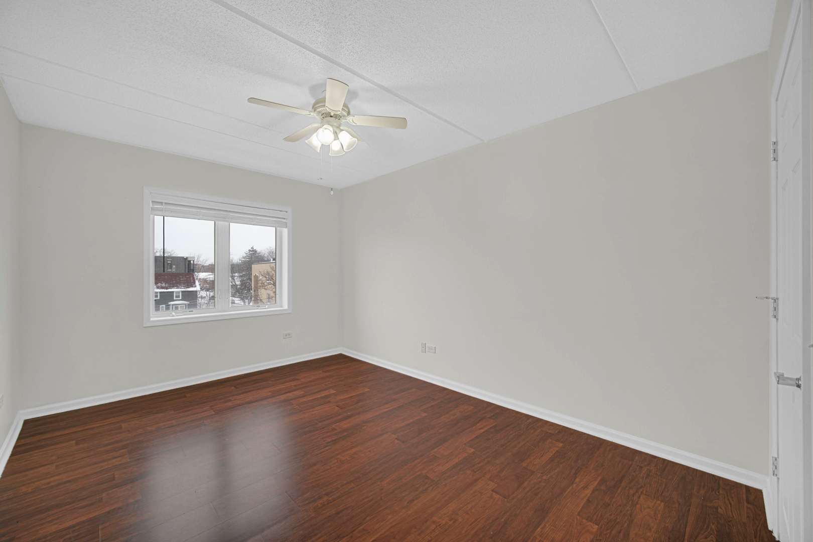 476 Alles Street, Unit 406 Des Plaines, IL 60016 - Photo 25 of 25 wooden floor in an empty room with a window