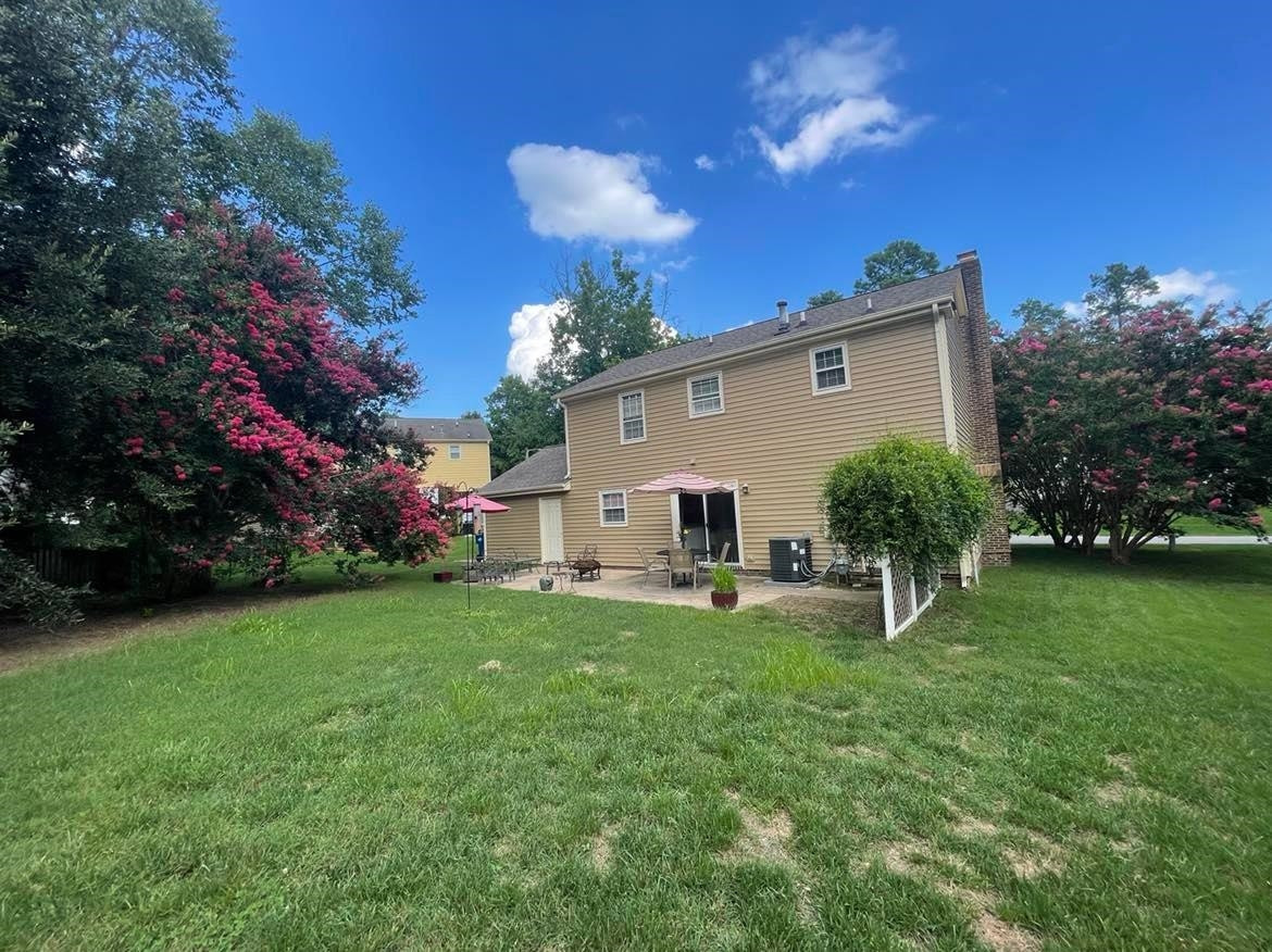 Nice privacy fence and large crepe myrtles Level backyard