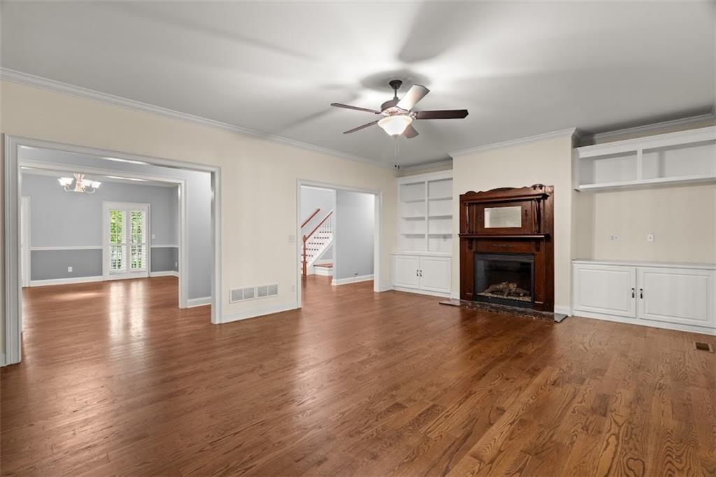 2058 Sewanee Court Villa Rica, GA 30180 - Photo 17 of 91 a view of an empty room with wooden floor and a fireplace