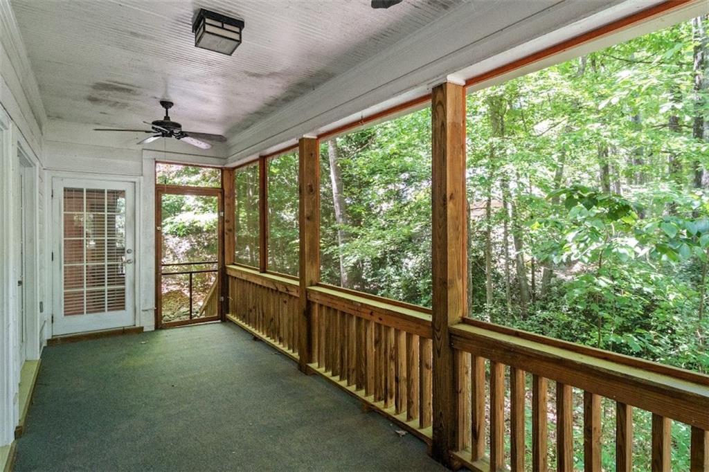2058 Sewanee Court Villa Rica, GA 30180 - Photo 25 of 91 a view of a porch with wooden floor and roof