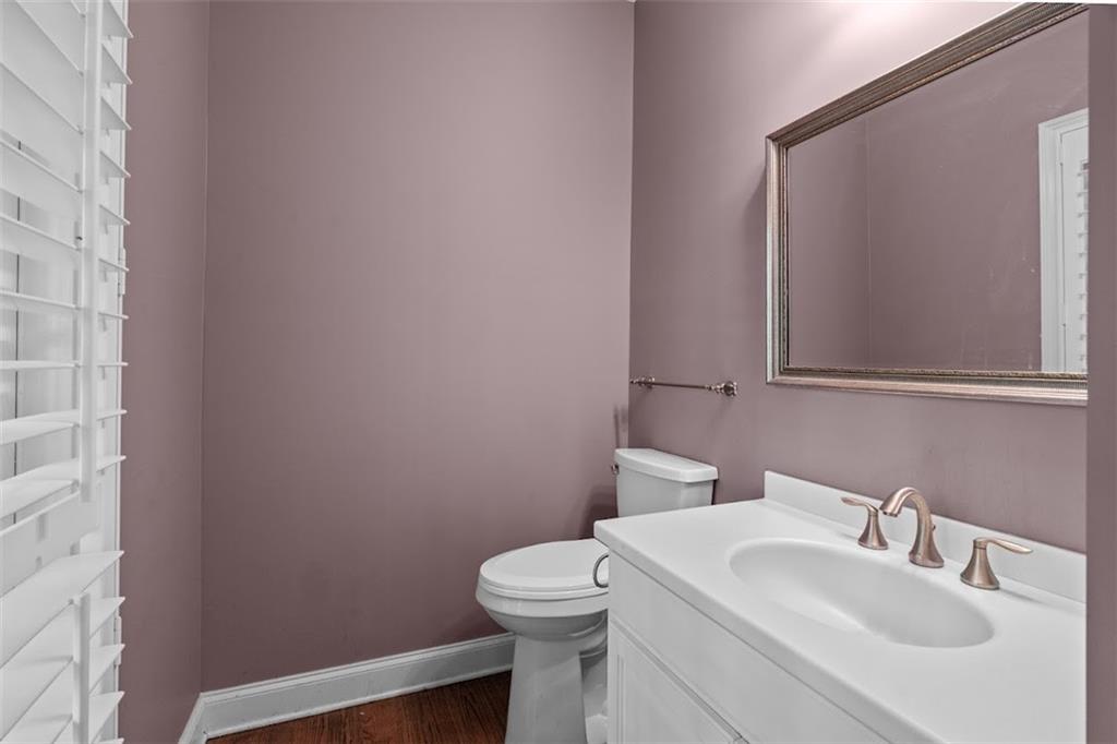 2058 Sewanee Court Villa Rica, GA 30180 - Photo 26 of 91 a bathroom with a sink a toilet and mirror