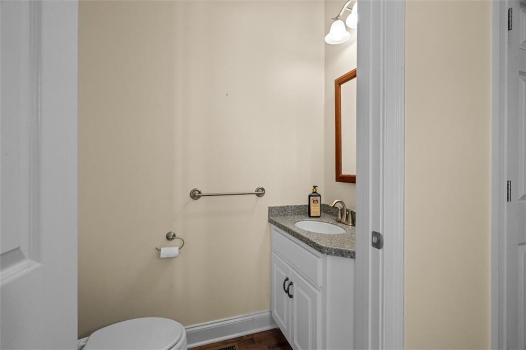 2058 Sewanee Court Villa Rica, GA 30180 - Photo 27 of 91 a bathroom with a sink and mirror with toilet