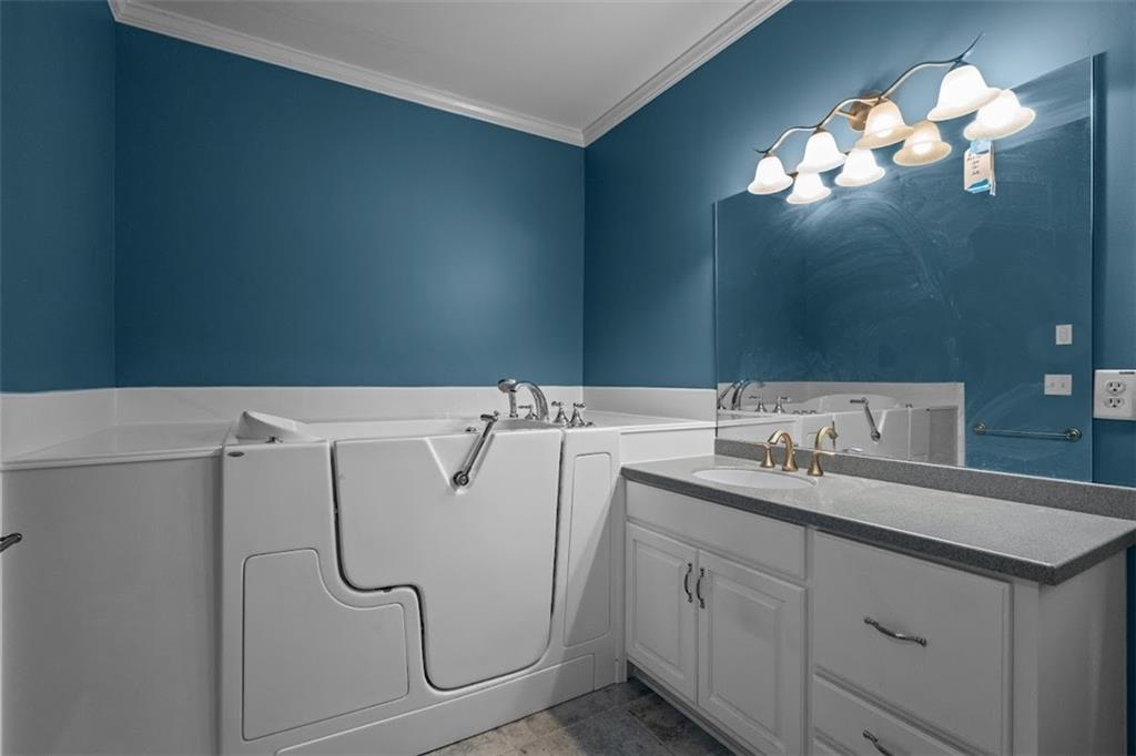 2058 Sewanee Court Villa Rica, GA 30180 - Photo 31 of 91 a bathroom with a sink vanity and mirror