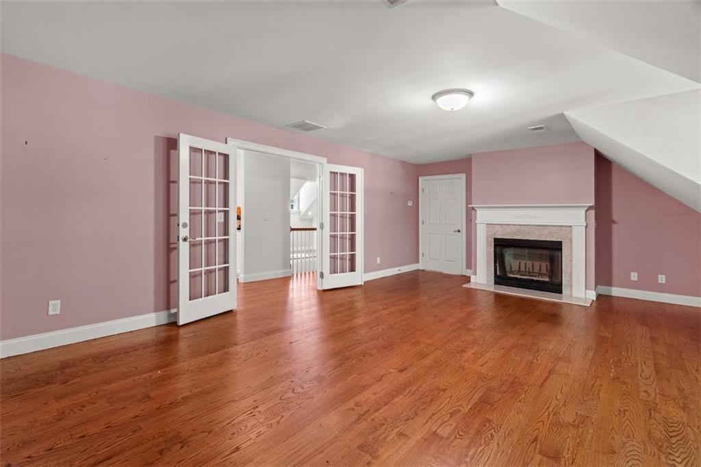 2058 Sewanee Court Villa Rica, GA 30180 - Photo 41 of 91 a view of a livingroom with wooden floor and a fireplace