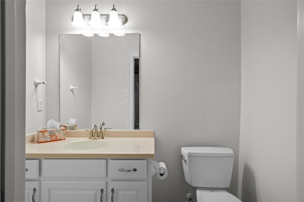 2058 Sewanee Court Villa Rica, GA 30180 - Photo 47 of 91 a bathroom with a toilet sink and mirror