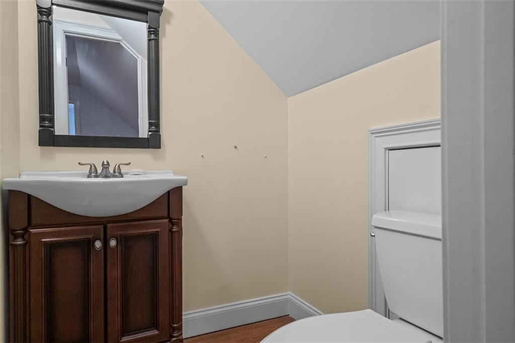 2058 Sewanee Court Villa Rica, GA 30180 - Photo 48 of 91 a bathroom with a toilet a sink and mirror