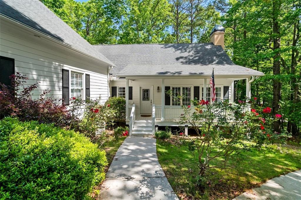 2058 Sewanee Court Villa Rica, GA 30180 - Photo 59 of 91 a front view of a house with a yard and potted plants