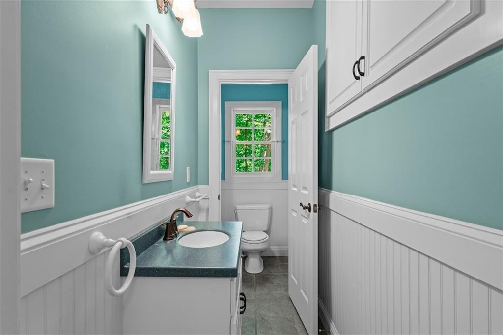 2058 Sewanee Court Villa Rica, GA 30180 - Photo 68 of 91 a bathroom with a granite countertop sink and a mirror