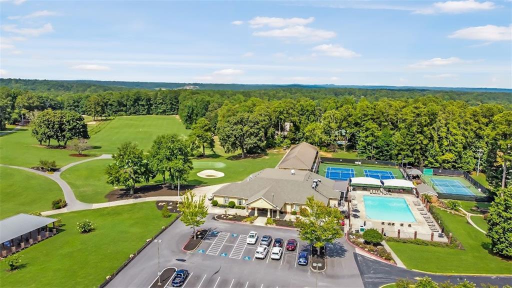 2058 Sewanee Court Villa Rica, GA 30180 - Photo 82 of 91 an aerial view of a city with lots of residential buildings and mountain view in back