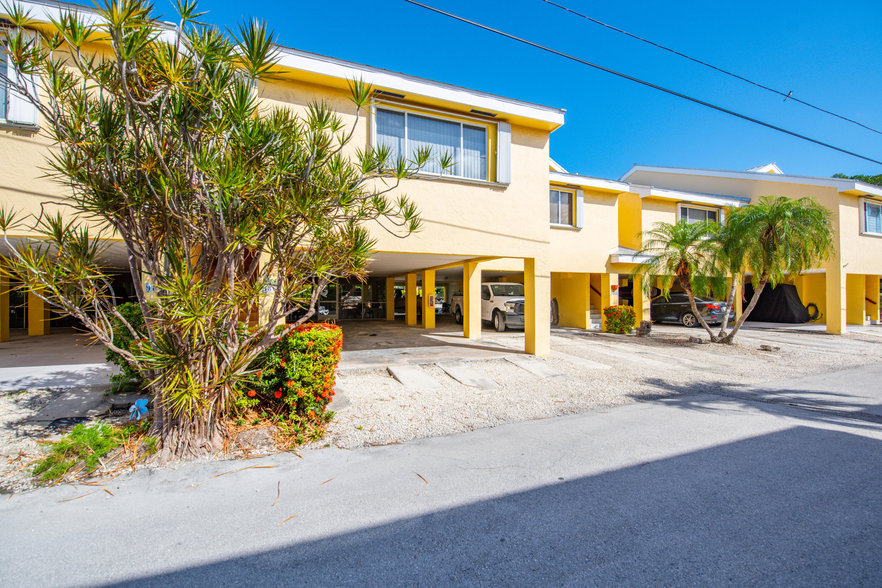 9867 Leeward Avenue Key Largo, FL 33037 - Photo 19 of 32 a front view of a building with street view