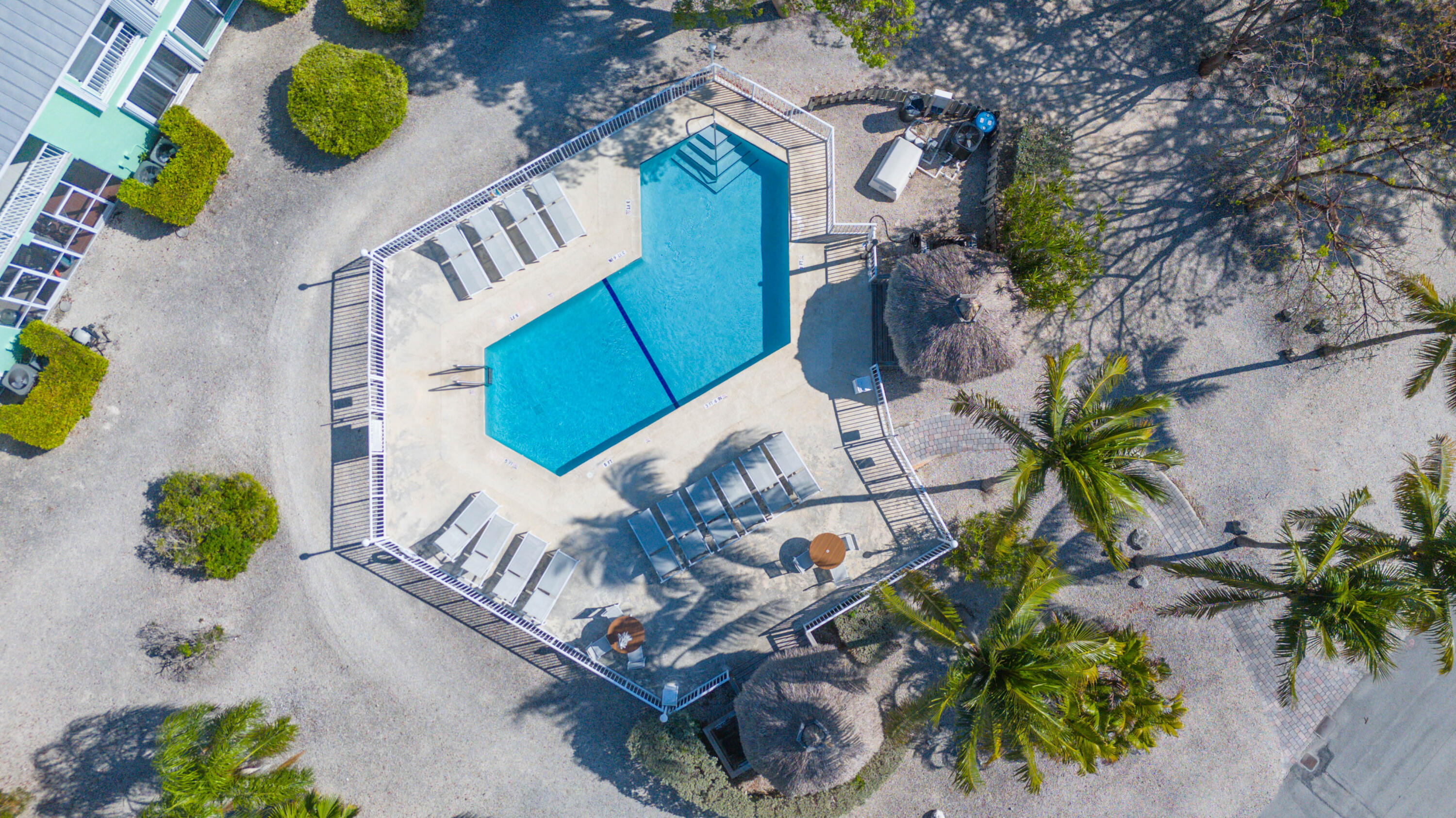 9867 Leeward Avenue Key Largo, FL 33037 - Photo 26 of 32 a picture of a table with chairs