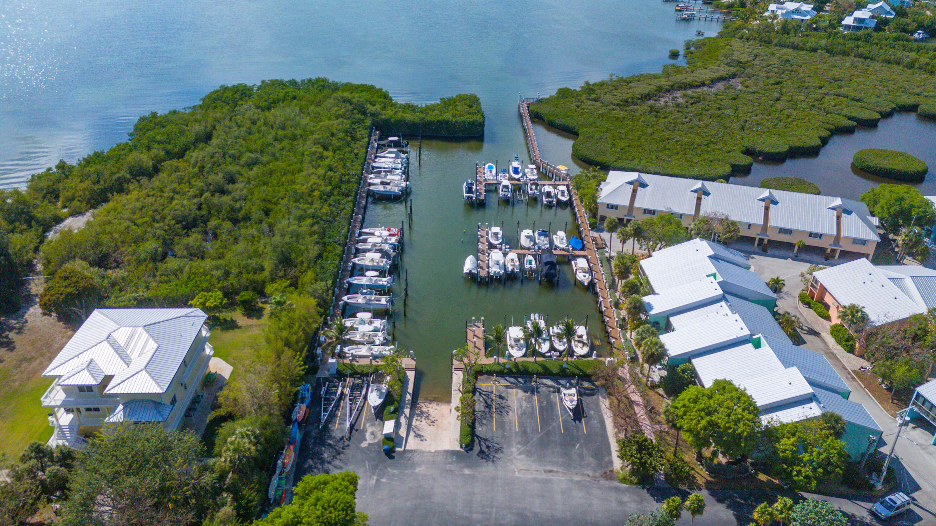 9867 Leeward Avenue Key Largo, FL 33037 - Photo 29 of 32 an aerial view of a house with yard swimming pool and outdoor seating