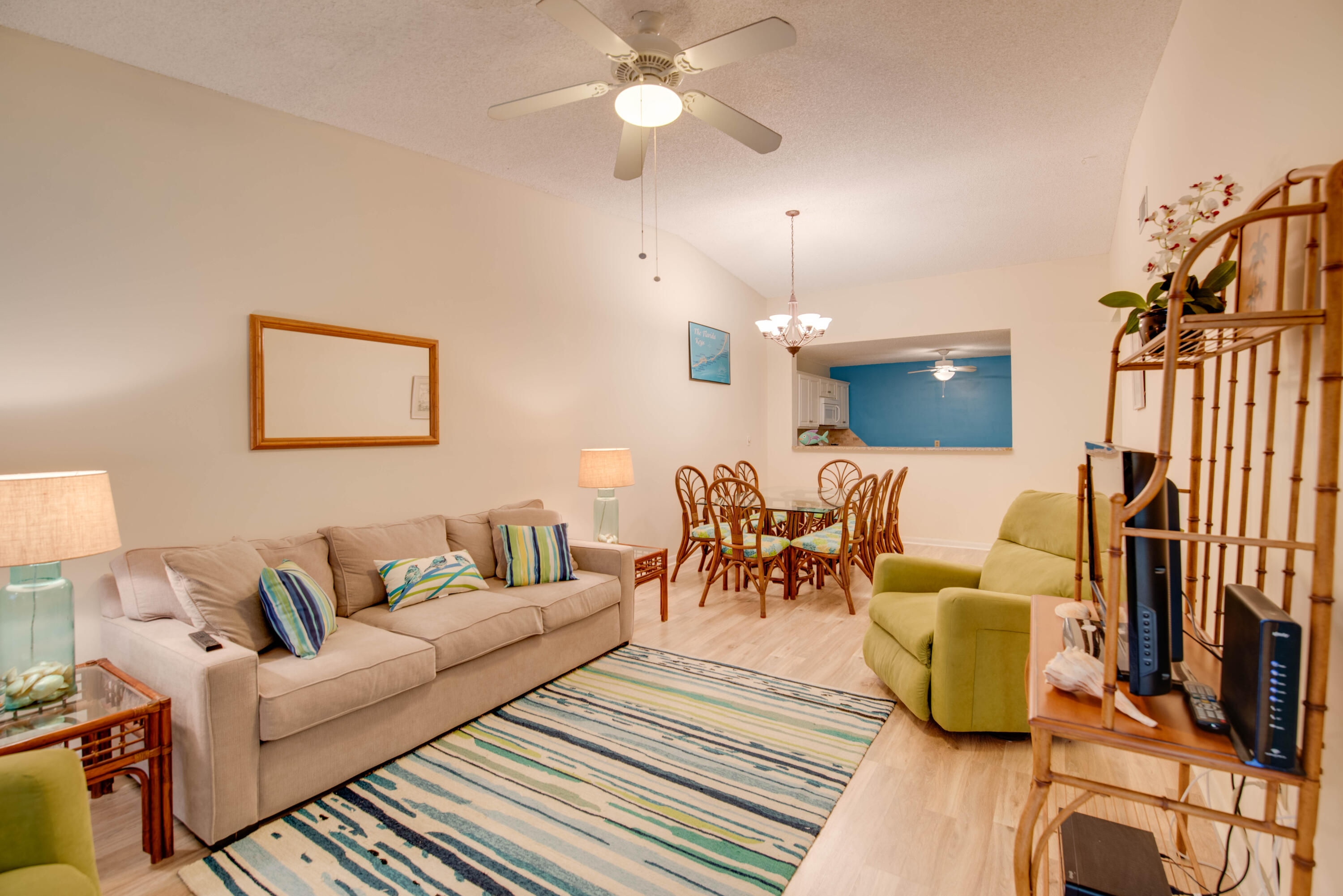 9867 Leeward Avenue Key Largo, FL 33037 - Photo 5 of 32 a living room with furniture and a chandelier