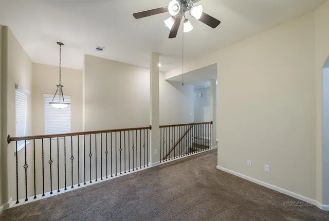 a view of a hallway with a chandelier