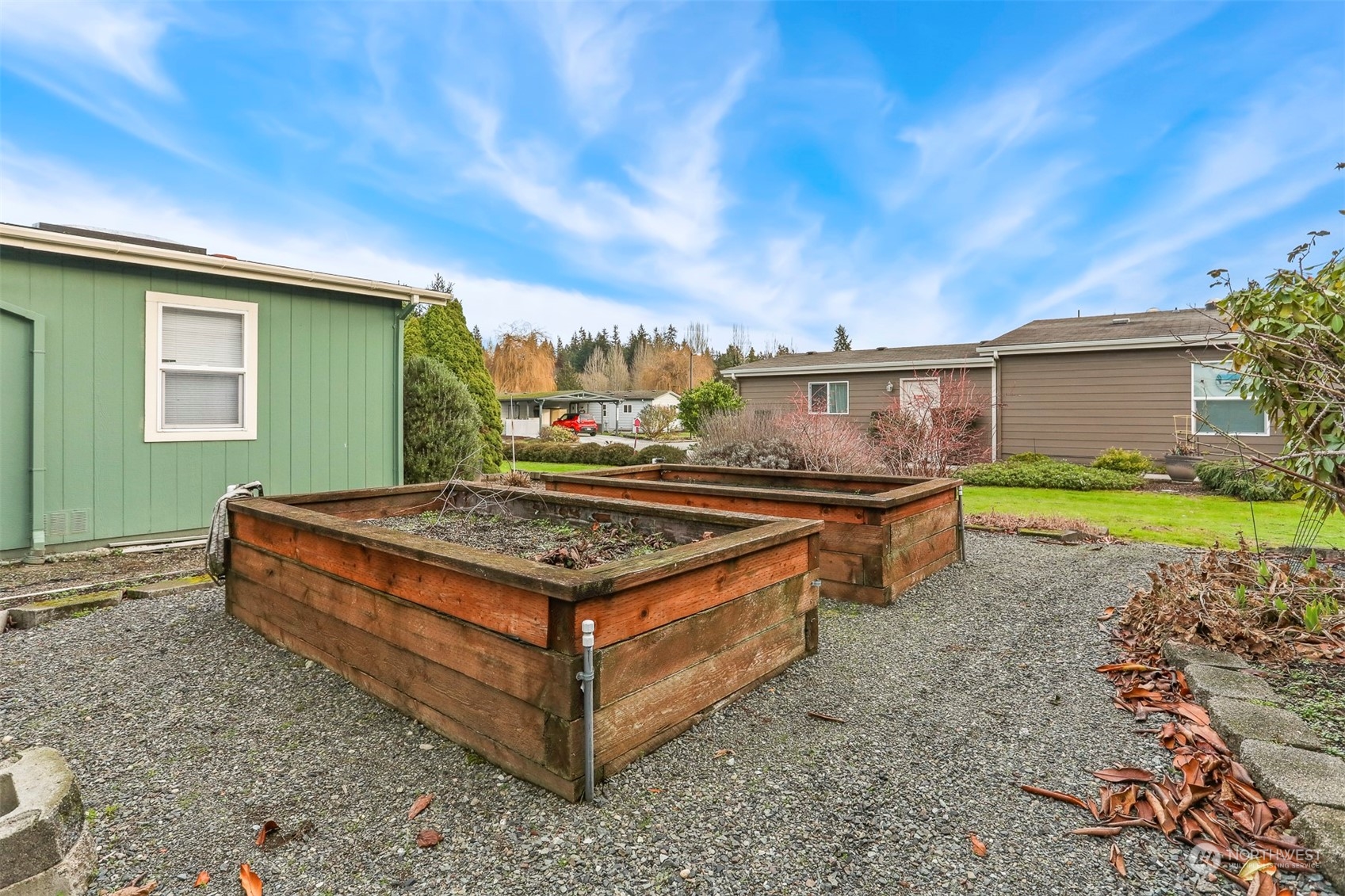 1110 Lake View Circle Bothell, WA 98021 - Photo 30 of 40 a view of a backyard with plants and a patio