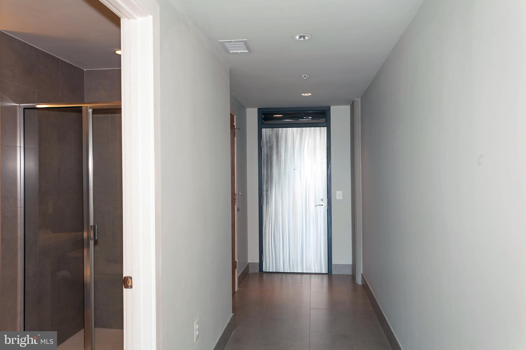 1133 14th Street Northwest, Unit 1109 Washington, DC 20005 - Photo 5 of 25 Wide Entry Hall & Access to Closet & Bath