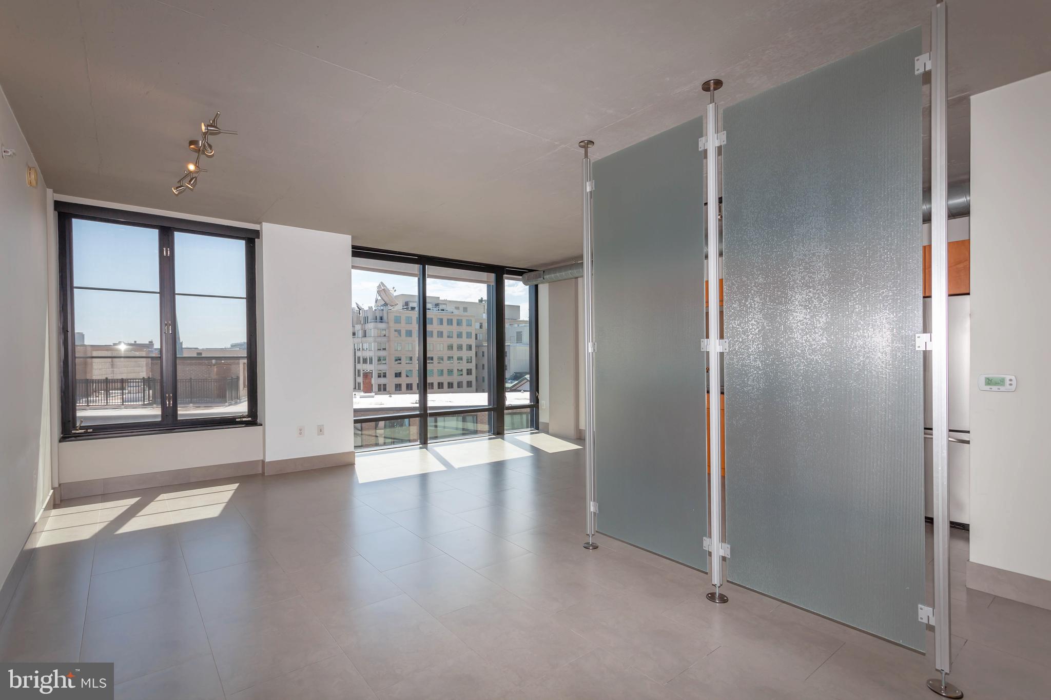 1133 14th Street Northwest, Unit 1109 Washington, DC 20005 - Photo 9 of 25 Living Space with Privacy Screen