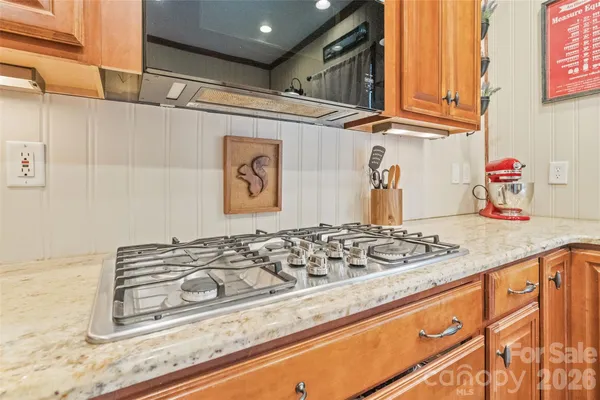 a bathroom with a granite countertop sink and a granite top