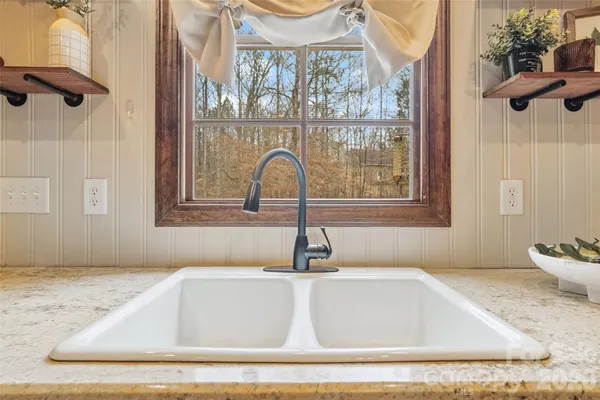 a bathroom with a granite countertop sink