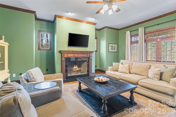 a balcony with furniture and wooden floor