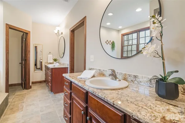 a bathroom with a glass shower door