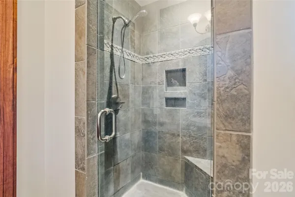 a bath tub sitting in a bathroom next to a window