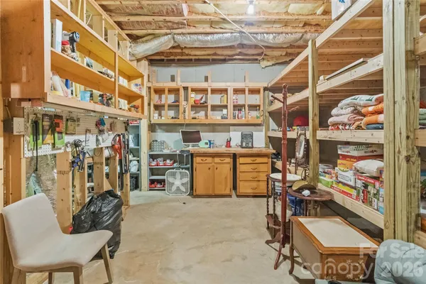 a bedroom with a bed and a chair
