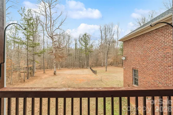 a view of a yard with a tree