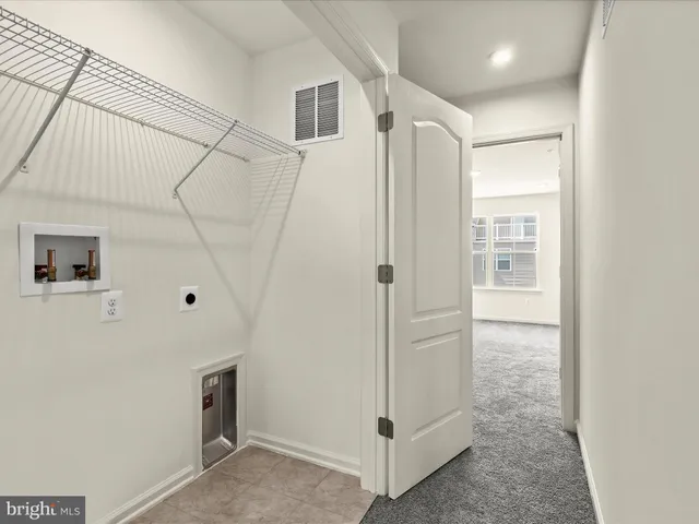 a bathroom with a shower and a glass door