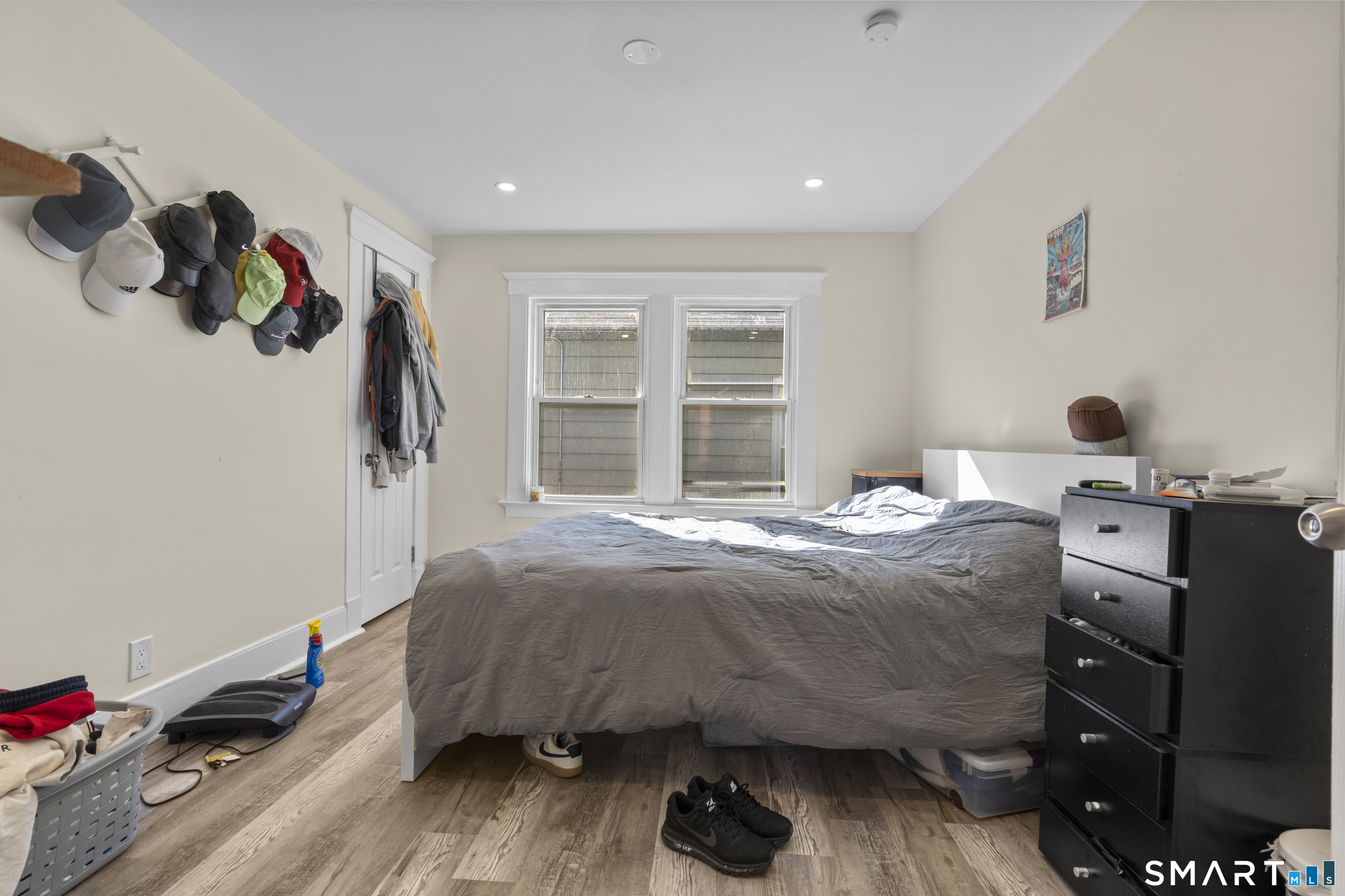 49-51 3rd Street Hamden, CT 06514 - Photo 11 of 40 a bedroom with a bed and wooden floor
