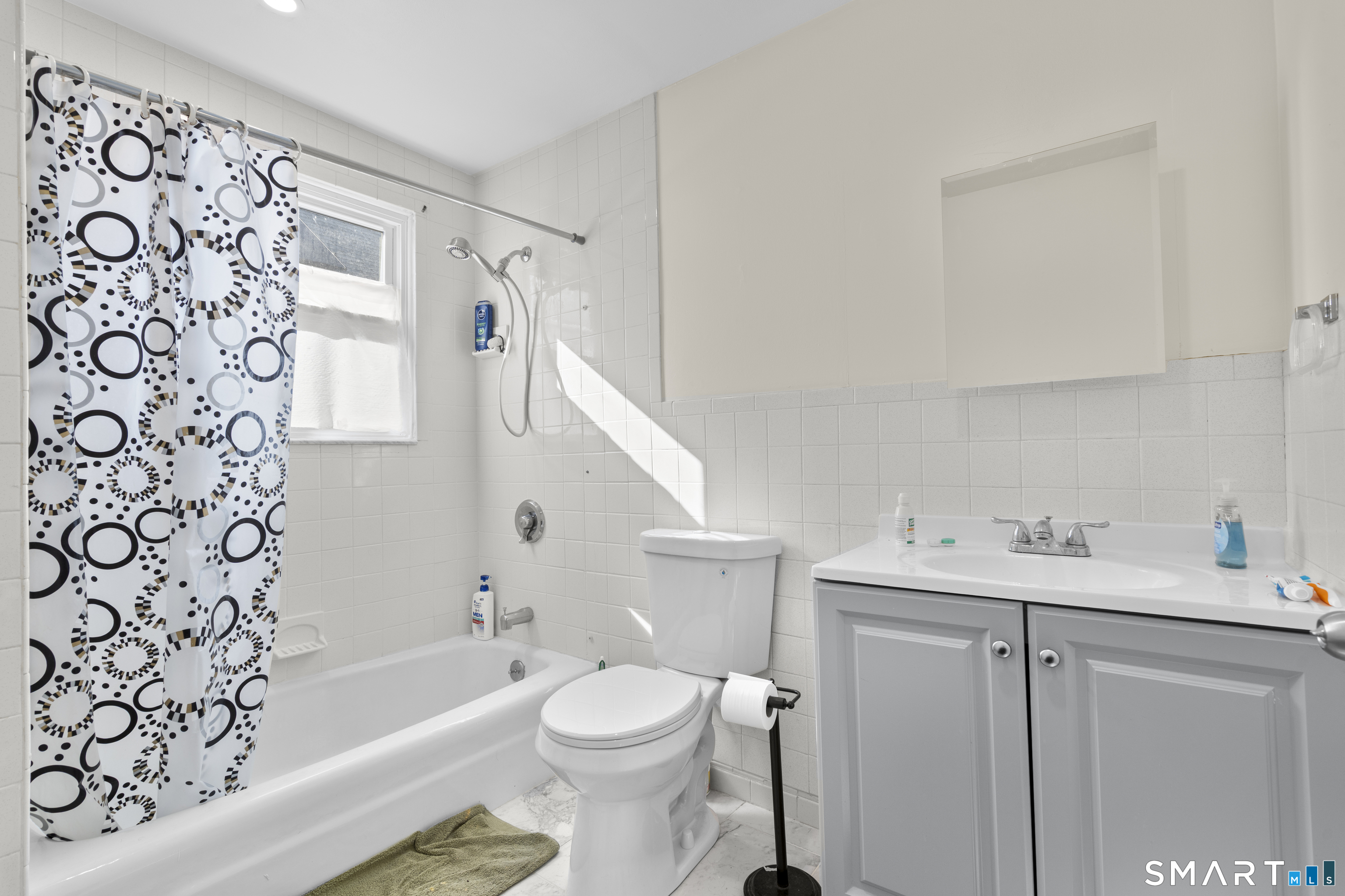 49-51 3rd Street Hamden, CT 06514 - Photo 12 of 40 a bathroom with a sink a toilet and a bathtub