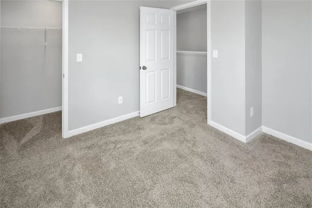 an empty room with closet area