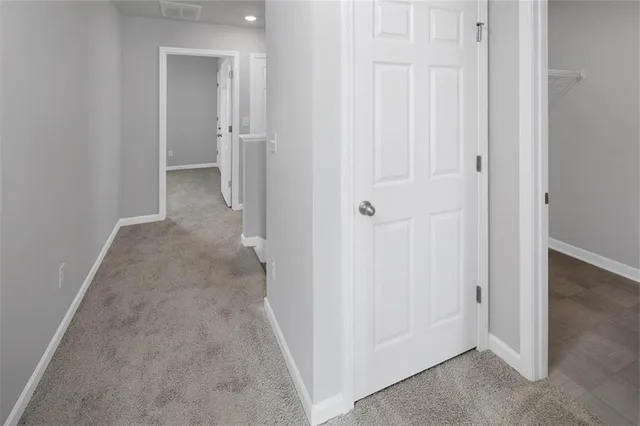 an empty room with a hallway
