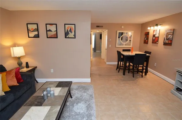 a bedroom with a bed and flat screen tv