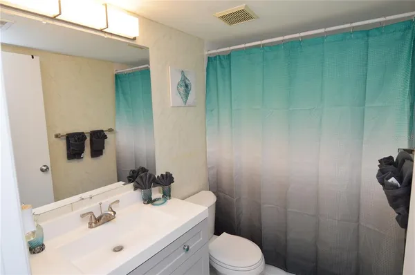 a view of an house with backyard and swimming pool