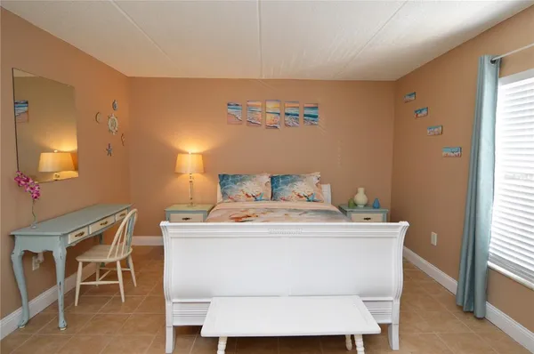 a view of swimming pool with a yard and sitting area