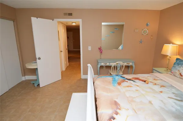 a view of a patio with swimming pool and sitting area